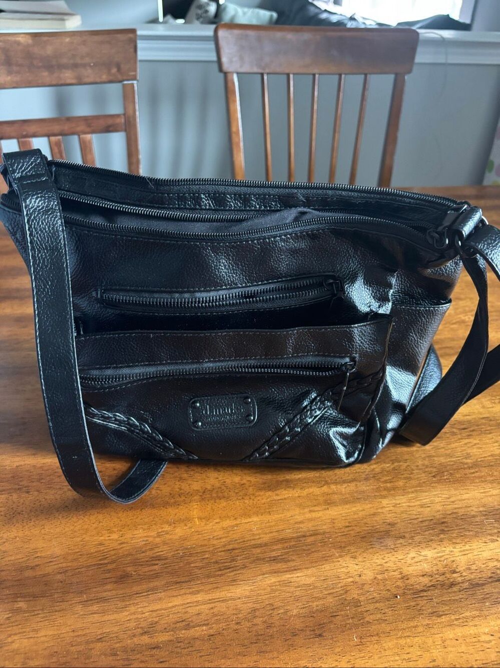 D. Marks women’s purse